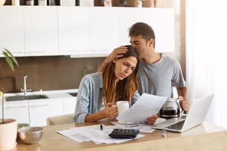 posts-how-to-avoid-bankruptcy - Harold Shepley & Associates, LLC A woman and a man looking sad at each other