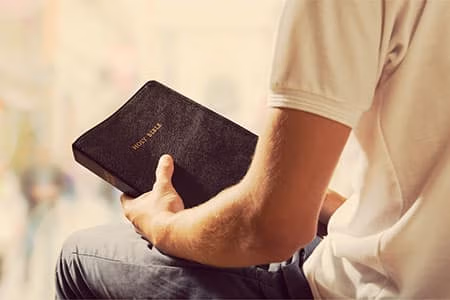 A man holding the holy bible
